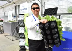 Noel Yan of T.O Plastics presenting the Sure Root Pop Bottom. It is a 15 count tray with a pop bottom, which enables the grower to transplant easily; activate the dimple and it dislaunches the plant. Usually, growers were using a pot and tray, but this alternative is less labor intensive. Sure root series does not have a flat side, so root development seems to be better as well. 